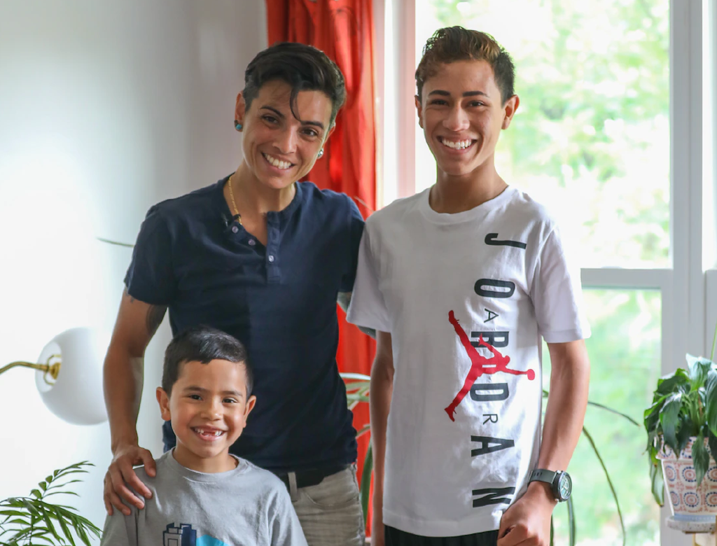Andrea Uribe with their foster-children Ethan, 13, Julian, 6, and dog Lu, at their Huguenot home. (Staten Island Advance/Alexandra Salmieri)