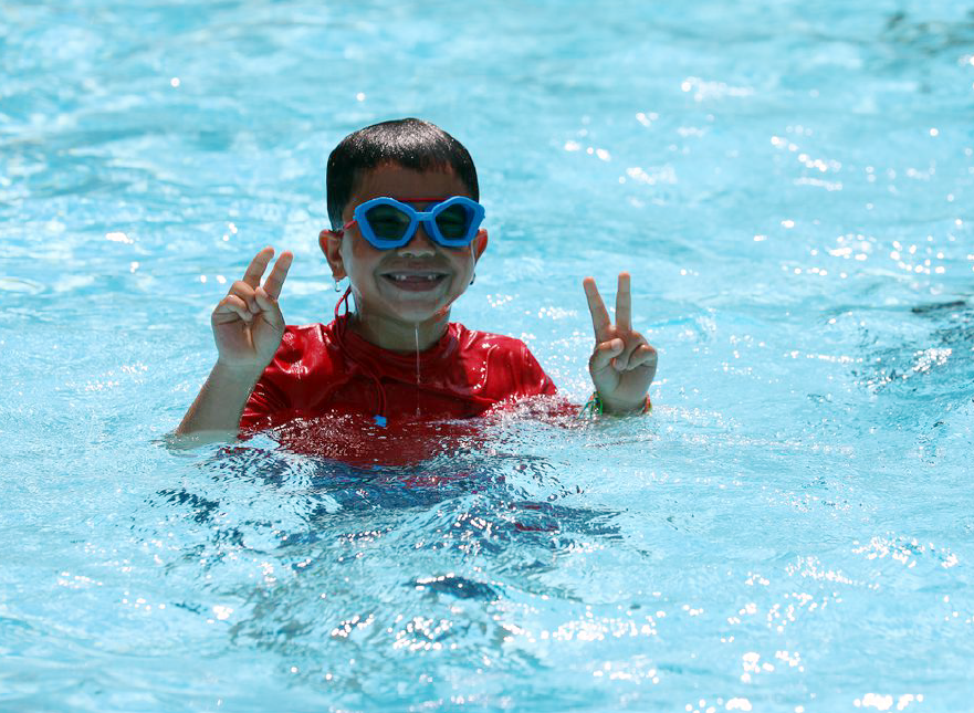 Andrea Uribe with their foster-children Ethan, 13, Julian, 6, and dog Lu, at their Huguenot home. (Staten Island Advance/Alexandra Salmieri)